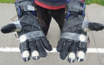 This initial prototype shows the FlexiForce A401 sensors attached to the outside of the gloves. (1)