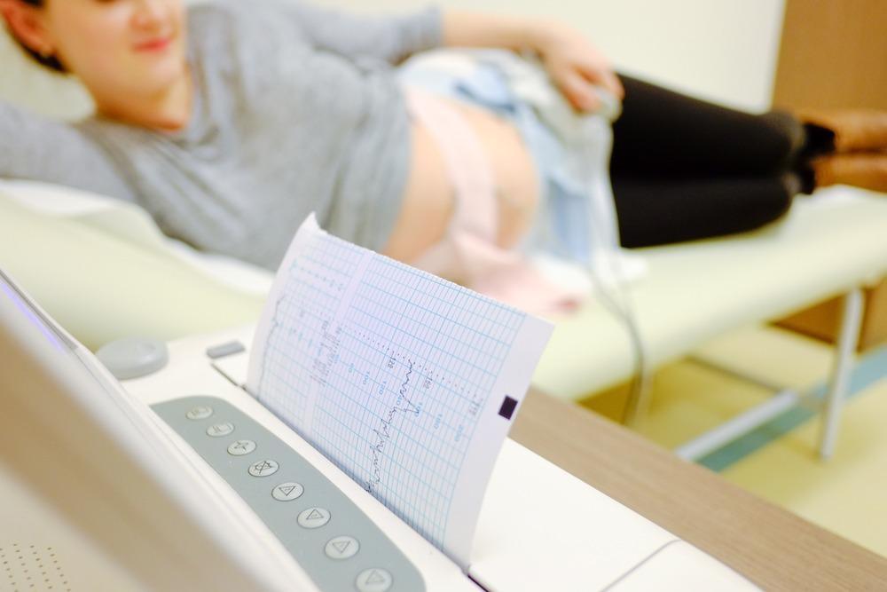 pregnant woman attached to ECG