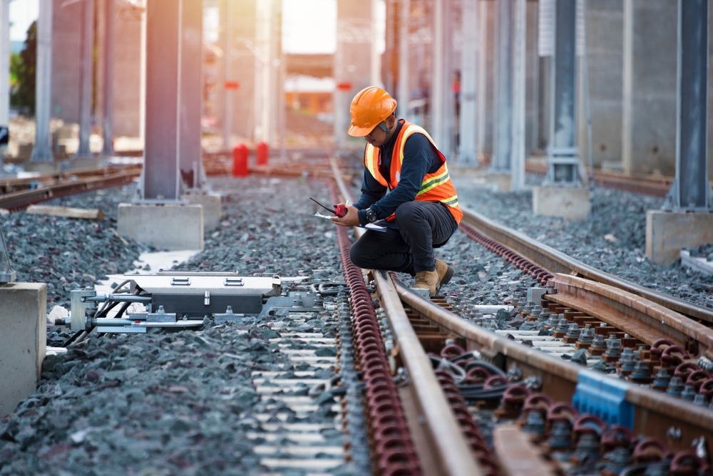 Engineer sitting on railway inspection. construction worker on railways.