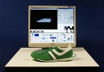 Specialized Running Shoe with Sensors and Microelectronics Evaluates Running Form of Athletes